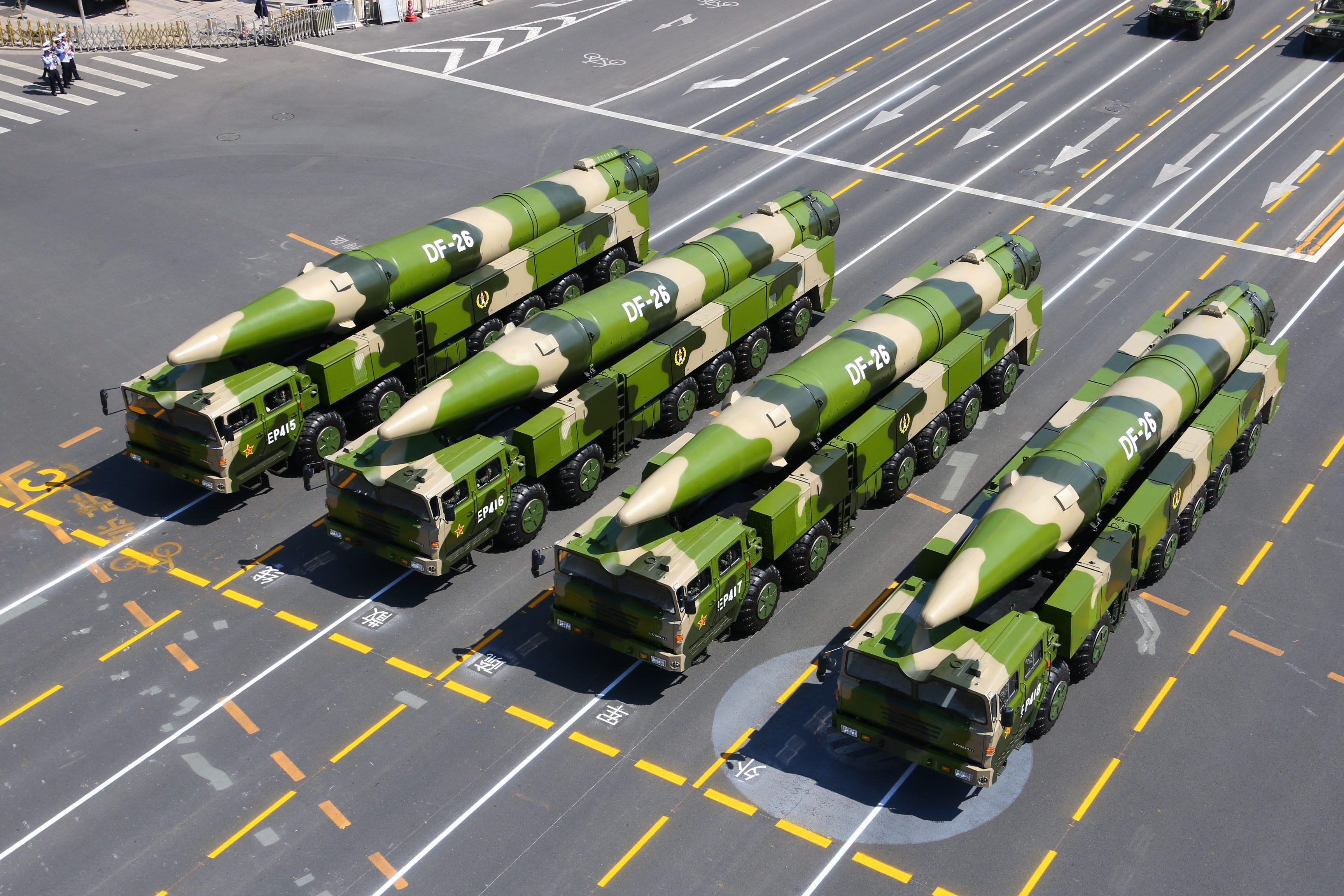 A column of DF-26 intermediate-range ballistic missile TELs.
