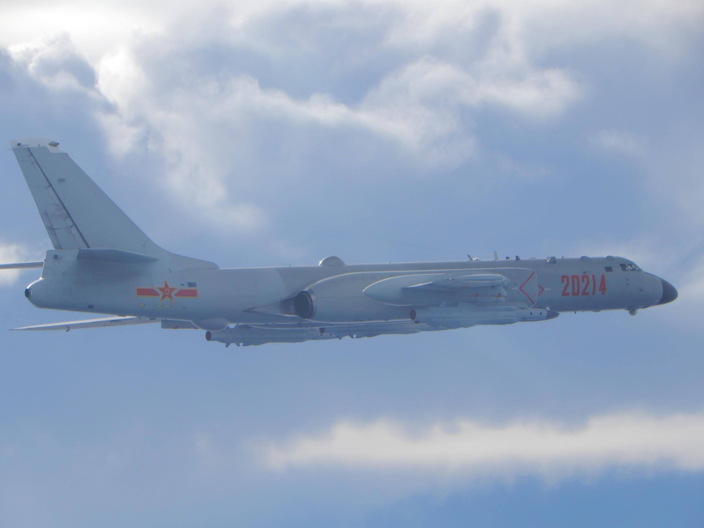 A PLANAF H-6 carrying YJ-18 anti-ship cruise missiles.